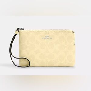 Coach corner Zip Wristlet wallet Signature Canvas Pale Yellow Silver Accent NWT